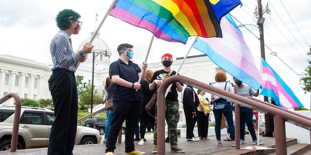 Protestors rally in support of transgender rights outside the Alabama State House in Montgomery on March 30, 2021.