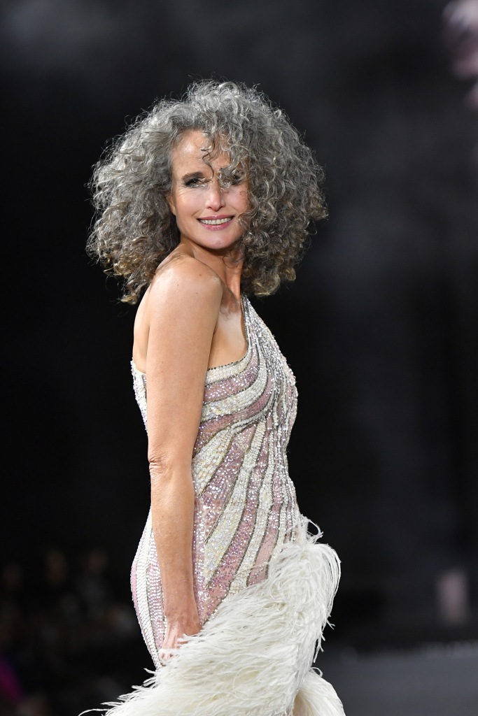 MacDowell models in a gray sparkling dress with her silver hair.