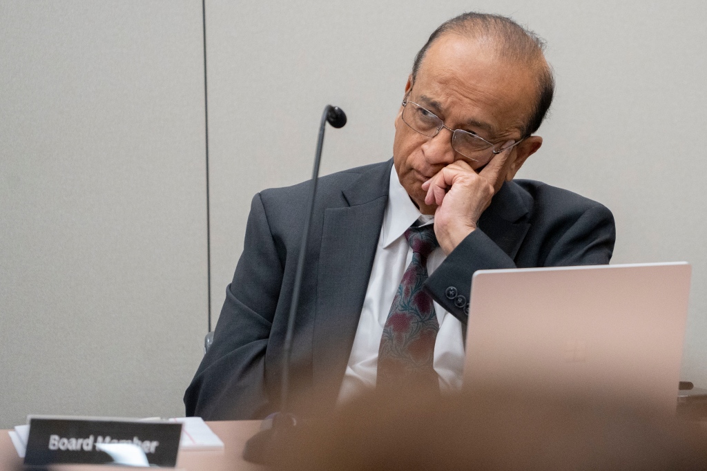 Board member Dr. Bharat H. Barai is spotted listening during the hearing of the state medical board at the Indiana Government South building in Indianapolis on May 25, 2023. 